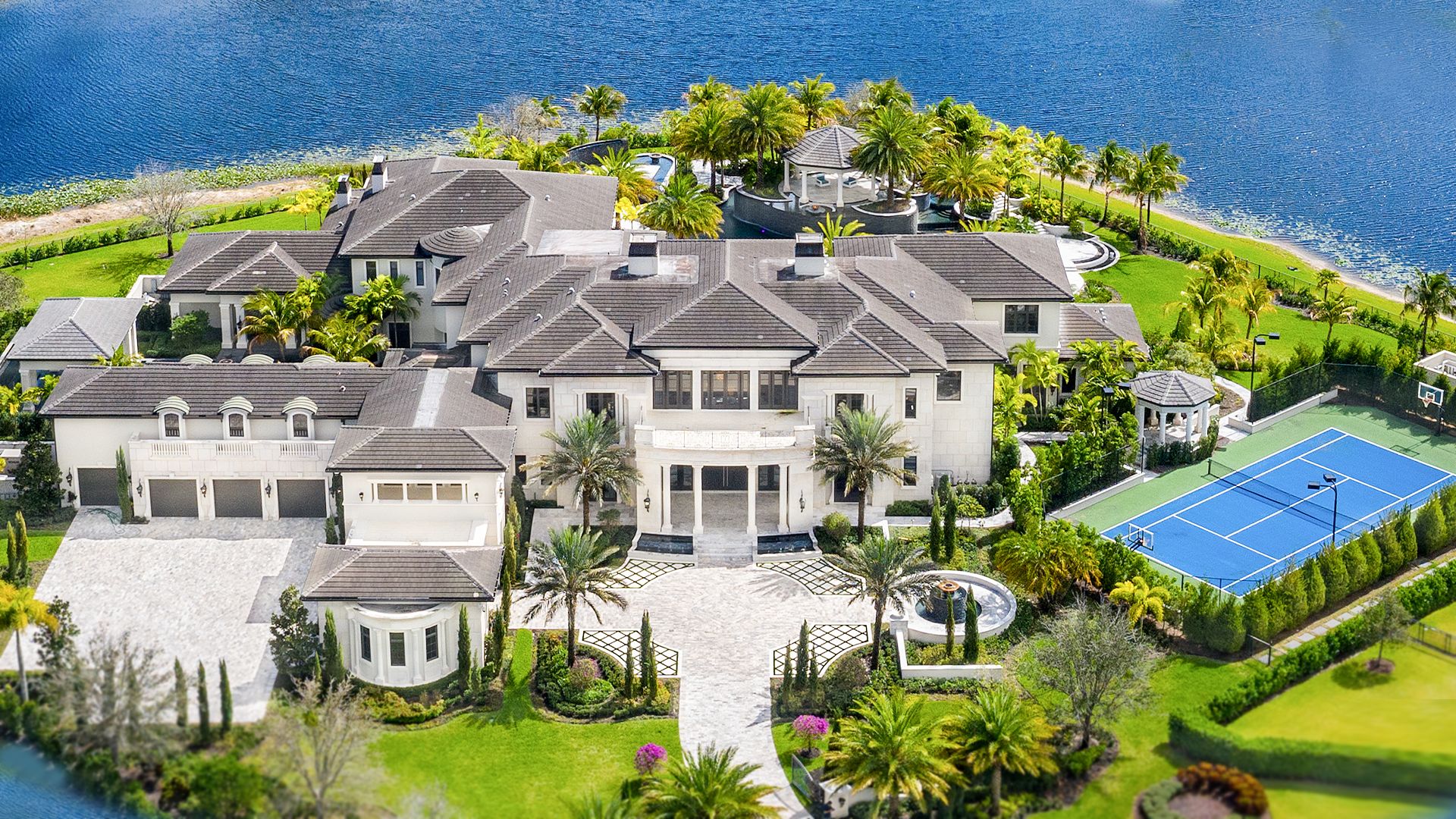 aerial view of a luxurious mansion on a coastal estate