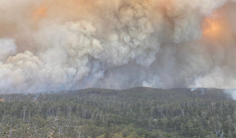 Bushfire smoke over Australian river valley