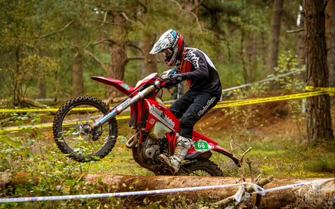 Motorbike trials competition muddy terrain