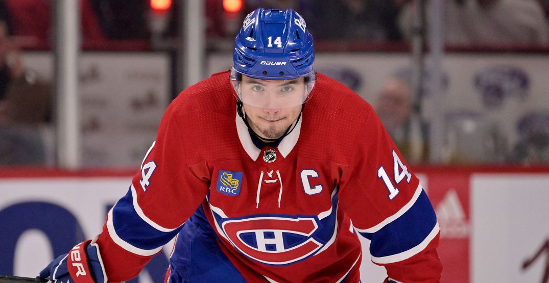 Nick Suzuki celebrates after returning to Montreal following Olympic gold medal win