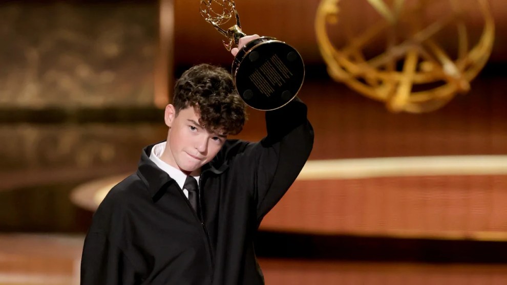 Teen actor holding Emmy award